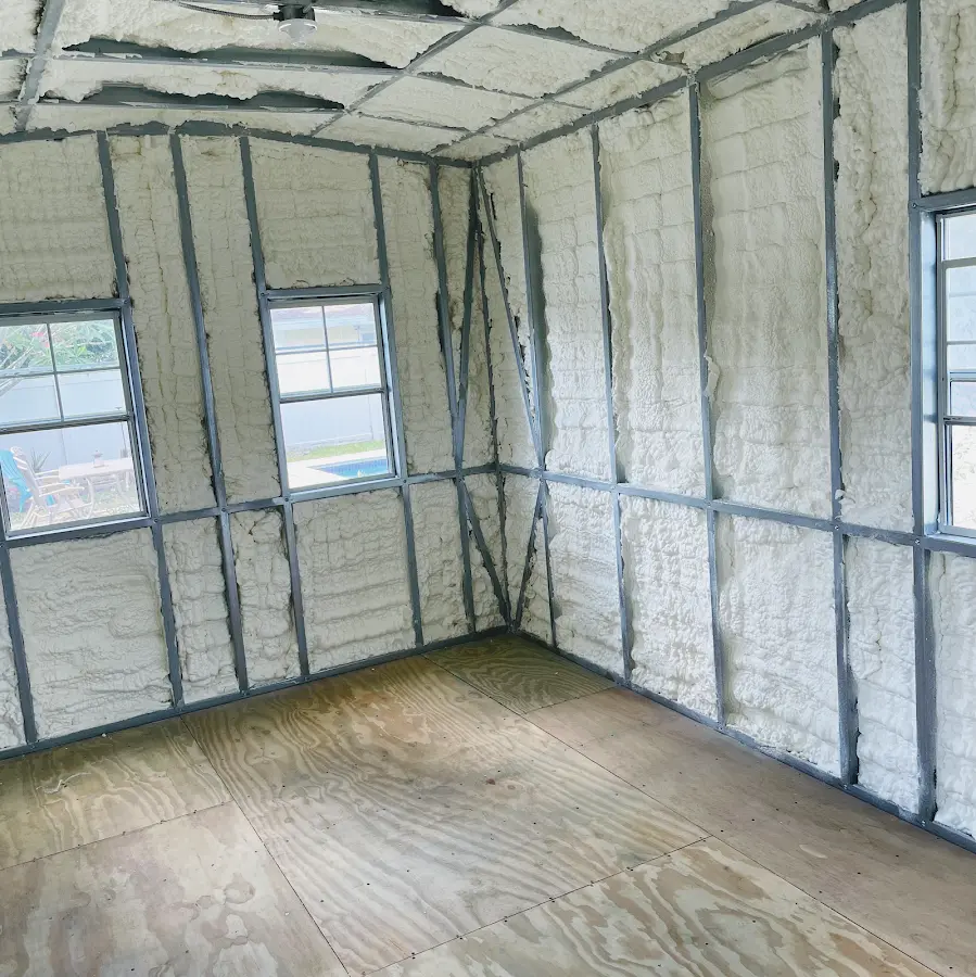 Closed-cell spray foam insulation applied to wall cavities in a residential project in Glasgow